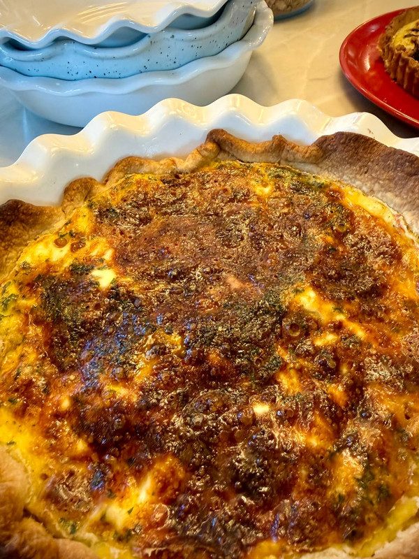 A finished quiche with a deep gold top